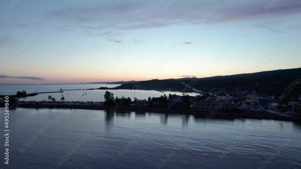 Late evening drone shot over Grand Marais harbor with boats Late evening drone shot over Grand Marais harbor with boats