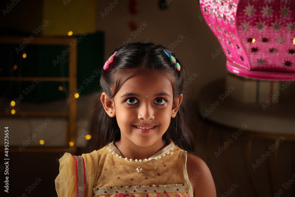 Portrait of an Happy girl during Diwali festival, India Portrait of an Happy girl during Diwali festival, India