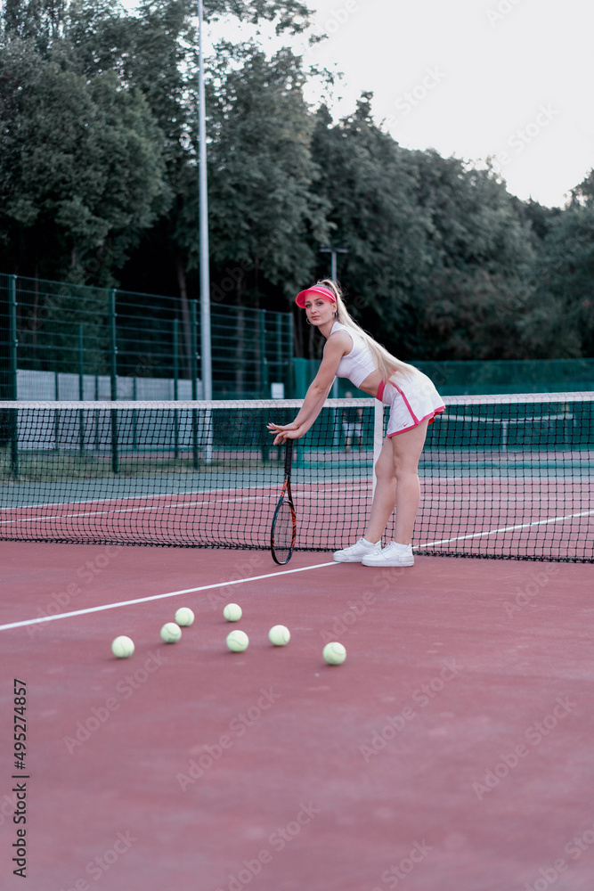 girl playing tennis in the city tennis court