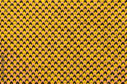 Yellow  red and black synthetic knitted fabric texture