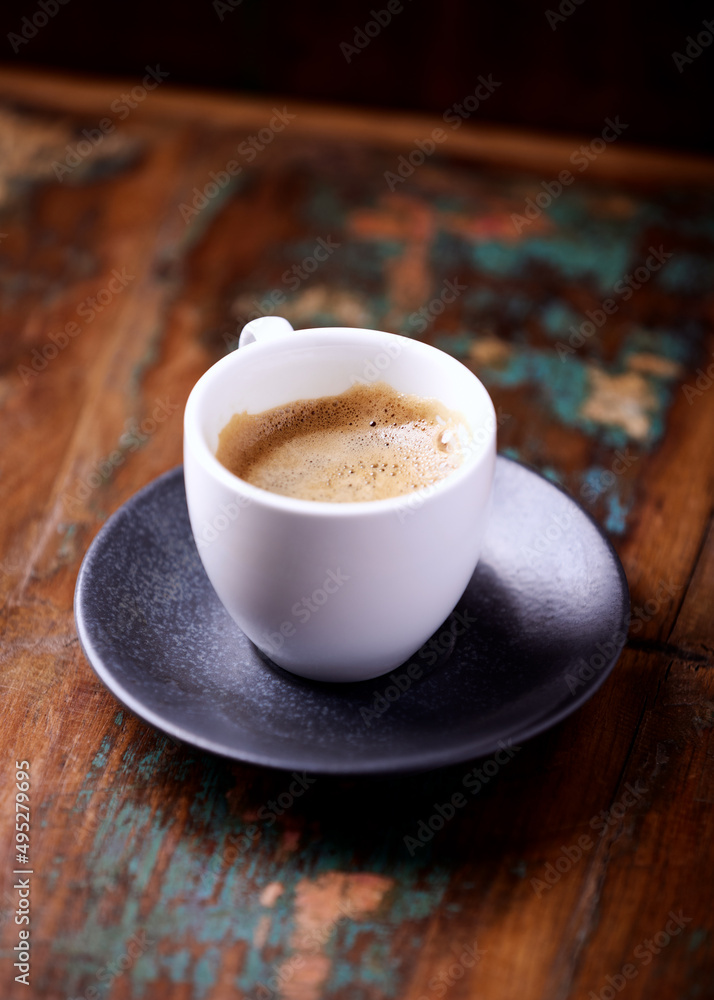 Cup of coffee on rustic wooden background. Close up. Cup of coffee on rustic wooden background. Close up.