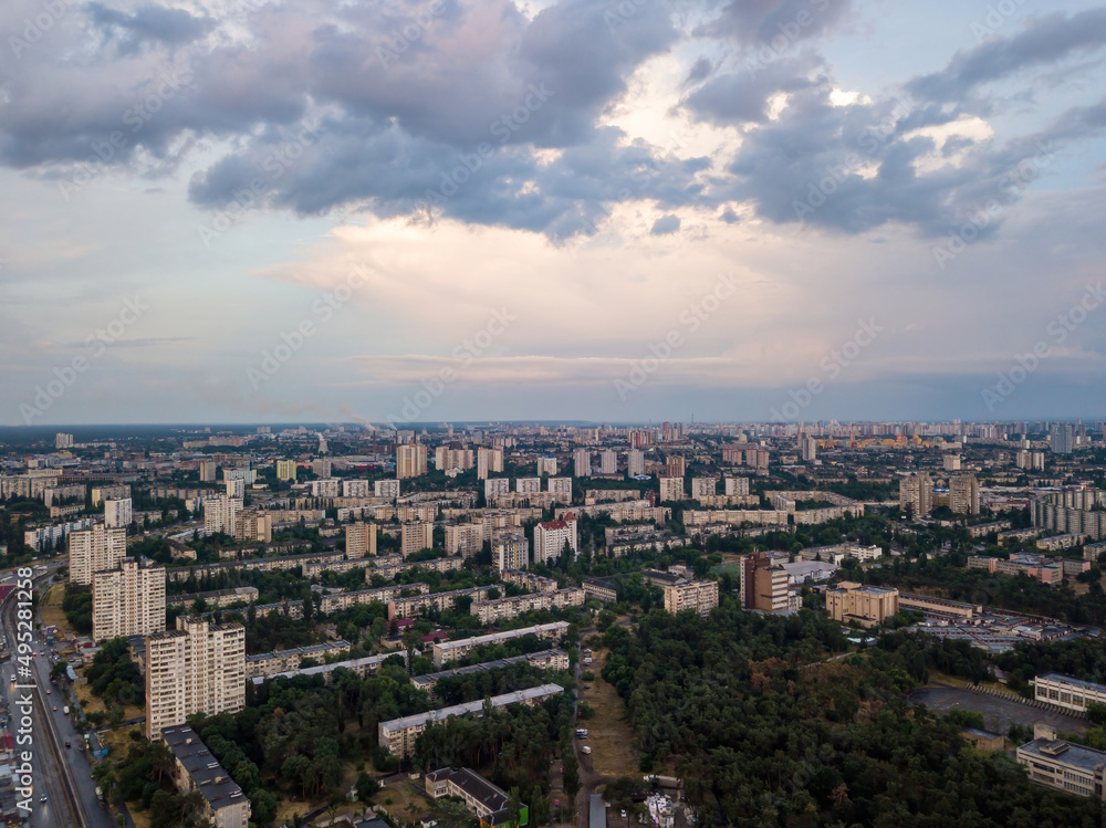 Sunset over Kiev. Rain clouds in the sky. Aerial drone view.