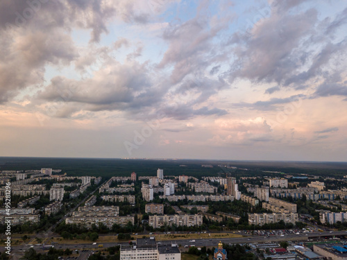 Sunset over Kiev. Rain clouds in the sky. Aerial drone view. © Sergey
