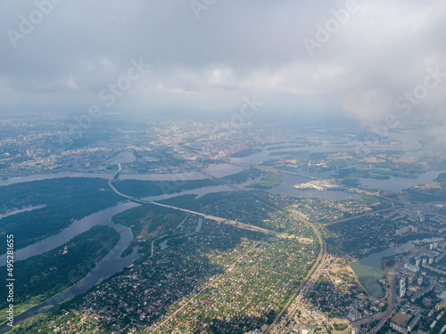 High flight over Kiev. Cloudy day. Aerial drone view. © Sergey