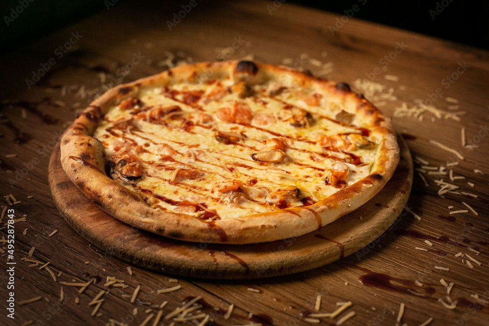 delicious italian pizza served on wooden table delicious italian pizza served on wooden table