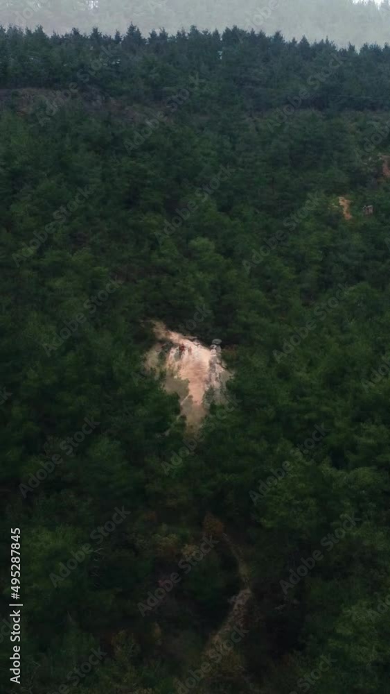 Aerial view of rock formations in middle of forest Aerial view of rock formations in middle of forest