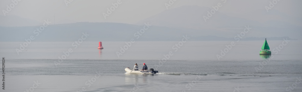 Naklejka premium Inflatable dingy boat out on sea adventure