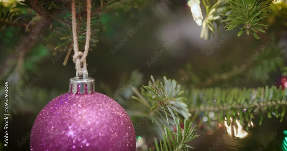 Christmas holiday tree ornaments sparkly purple ball tilt down Christmas holiday tree ornaments sparkly purple ball tilt down