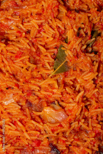 Wallpaper Mural Jollof rice close-up. Background of rice cooked in tomato paste with spices. Torontodigital.ca