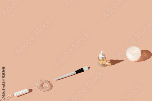 Layout made of woman beauty skincare accessories and hygiene cosmetic products. Pink pastel background. Pattern with copy space. © Nastassia Kudzina