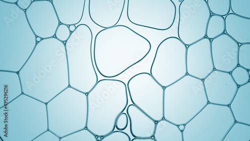 Macro shot of clear transparent liquid flows between different sized transparent bubbles against cyan background | Abstract skin care ingredients