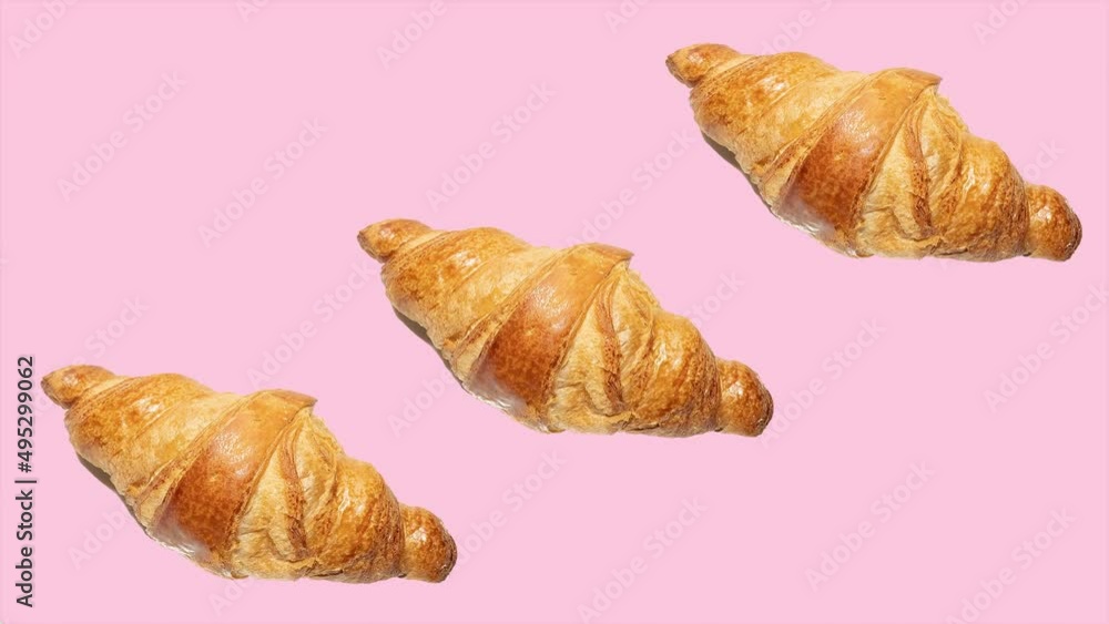Fresh croissants photographed on coloured backgrounds. They appear and disappear continuously, creating an ascending line. Top view, with hard light and pop art design. Fresh croissants photographed on coloured backgrounds. They appear and disappear continuously, creating an ascending line. Top view, with hard light and pop art design.