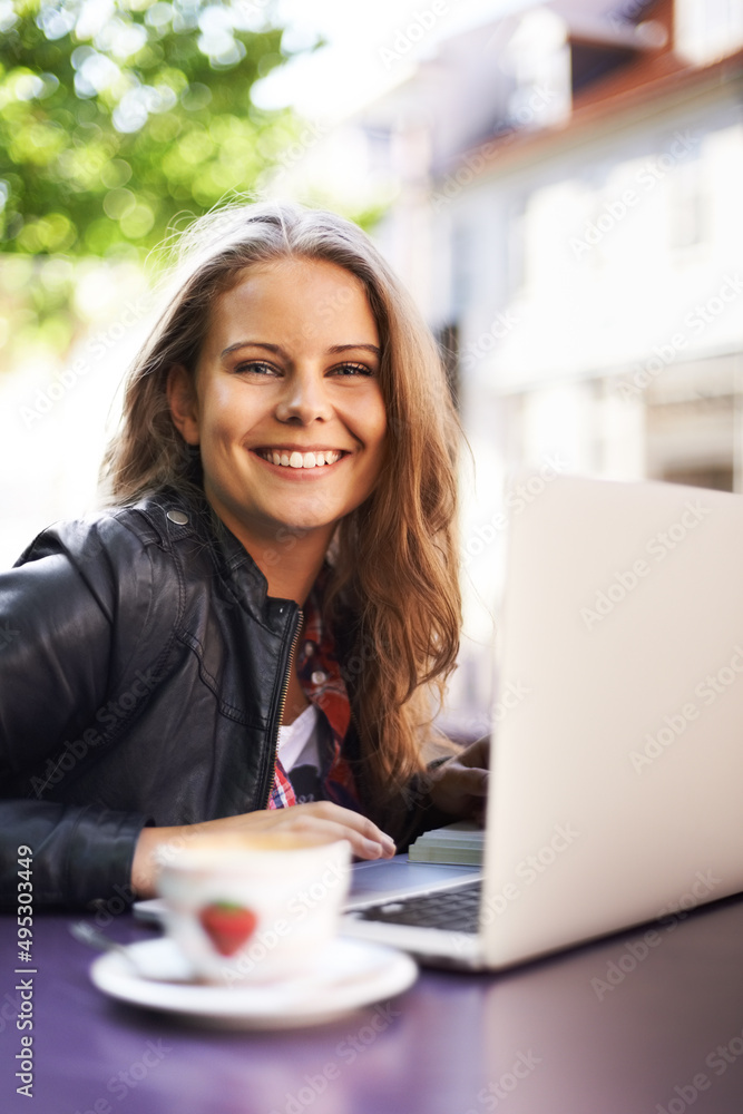 Enjoying the free wifi at the bistro. Portrait of a beautiful teen working on her laptop at a bistro. Enjoying the free wifi at the bistro. Portrait of a beautiful teen working on her laptop at a bistro.