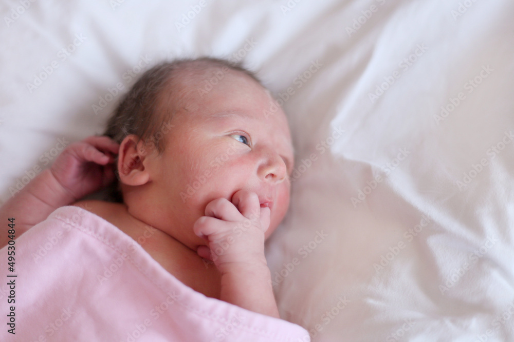new born baby sucking fingers. Selective focus baby is sucking finger represent to child development new born baby sucking fingers. Selective focus baby is sucking finger represent to child development