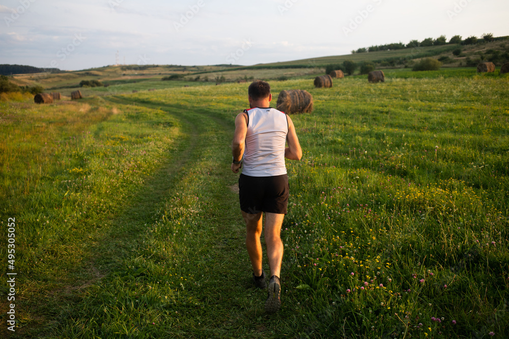 man running at sunset healthy active lifestyle man running at sunset healthy active lifestyle