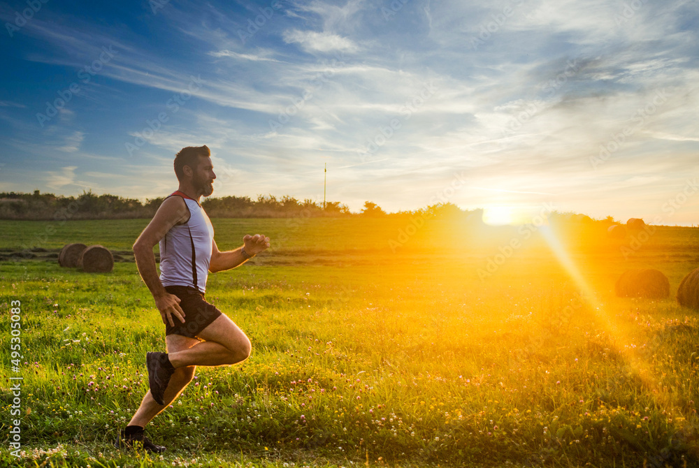 man running at sunset healthy active lifestyle man running at sunset healthy active lifestyle