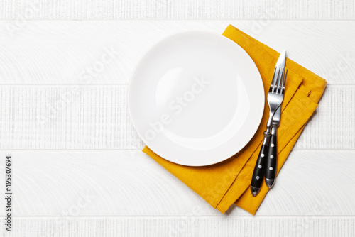 Canvas-taulu Empty plate and silverware on wooden table