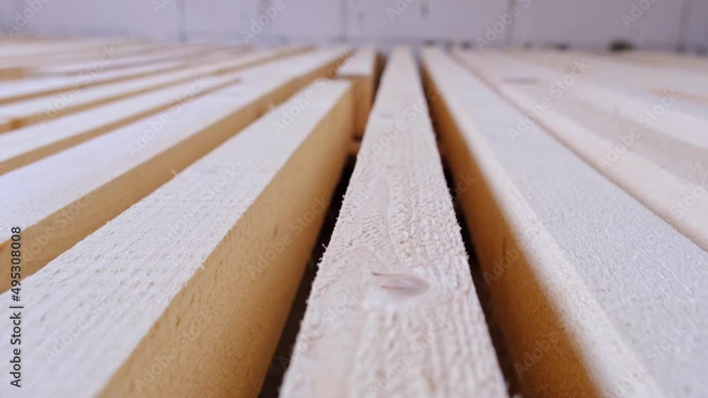 Sawn boards lie on the floor parallel to each other for drying. Preparation for the installation of an eco-friendly wooden floor in a rural house. Lumber from the sawmill Sawn boards lie on the floor parallel to each other for drying. Preparation for the installation of an eco-friendly wooden floor in a rural house. Lumber from the sawmill