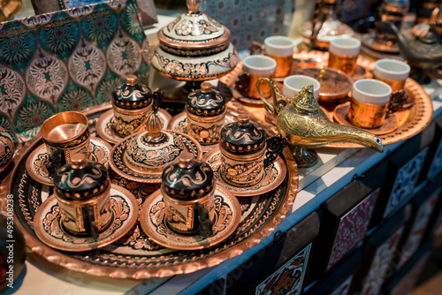 Metal tableware and calligraphy at the bazaar in Istanbul. One of the best things to buy antiques at Grand Bazaar