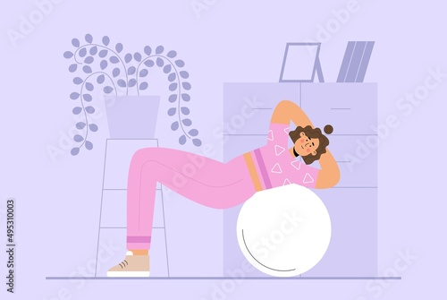 Woman doing exercises on a big fitness ball