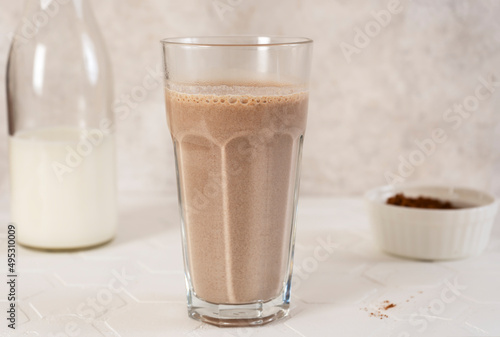 Delicious homemade cocoa drink with milk and cocoa powder. Horizontal orientation.