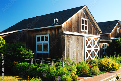 A summer garden blooms at a rustic barn in a winery in Jamesport Long Island