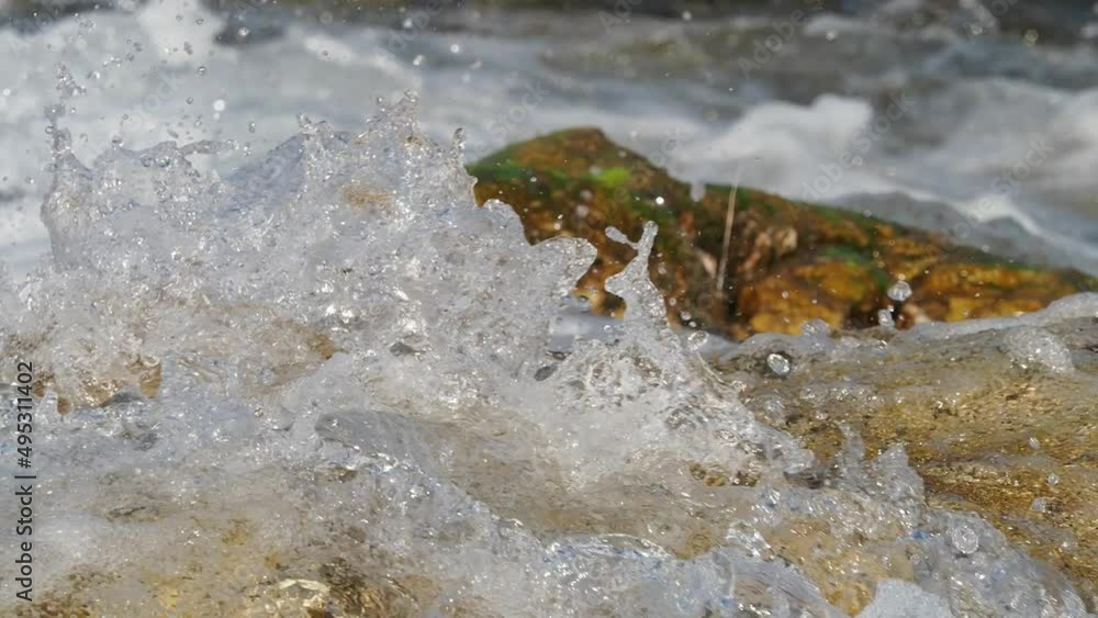 Wild mountain river flowing through stone boulders. Abundant clear stream in La Spezia Wild mountain river flowing through stone boulders. Abundant clear stream in La Spezia