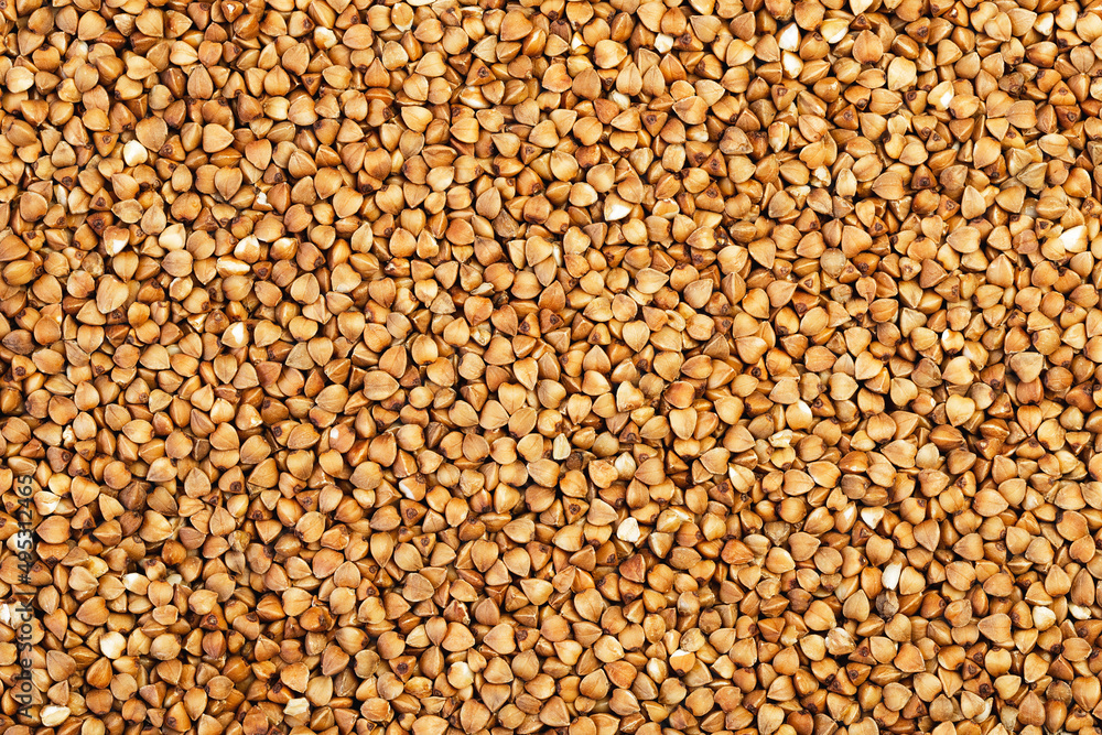 Buckwheat grains evenly spaced on the surface for background Buckwheat grains evenly spaced on the surface for background