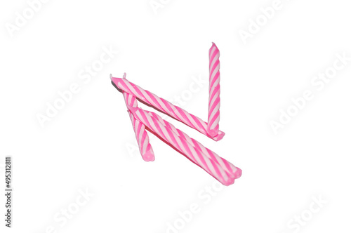 pink birthday cake candles on white background