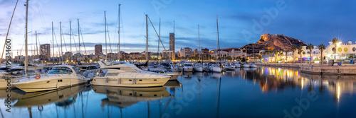 Alicante Port d'Alacant marina with boats and view of castle Castillo twilight travel traveling holidays vacation panorama in Spain