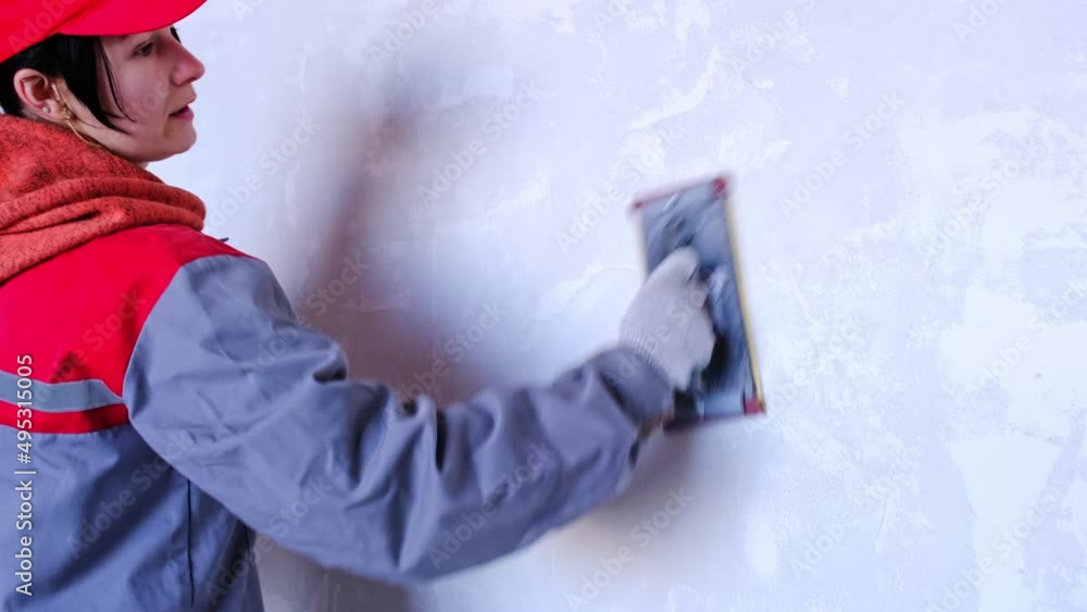 Sanding of walls with sandpaper after treatment with dry building mixes