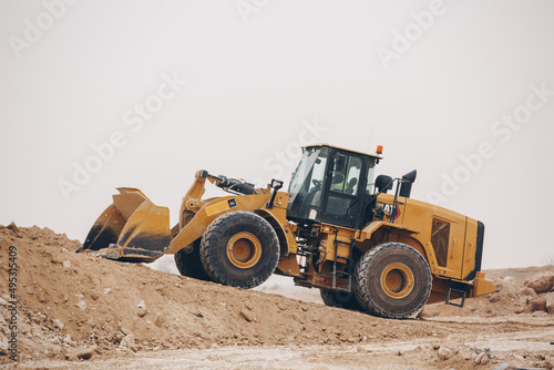 Dozer, excavator, and road rollers working on the mud site