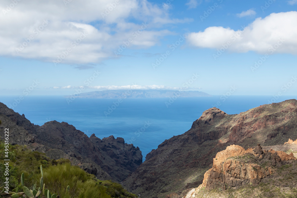 View on the Atlantic ocean and La Palma island from the Barranco Seco gorge, Tenerife, Canary islands, Spain View on the Atlantic ocean and La Palma island from the Barranco Seco gorge, Tenerife, Canary islands, Spain