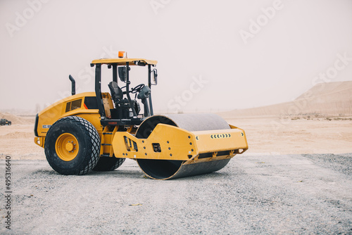 Dozer, excavator, and road rollers working on the mud site