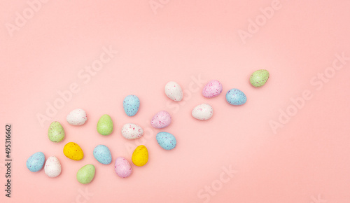 Colorful Easter eggs on a pink background © Anteria