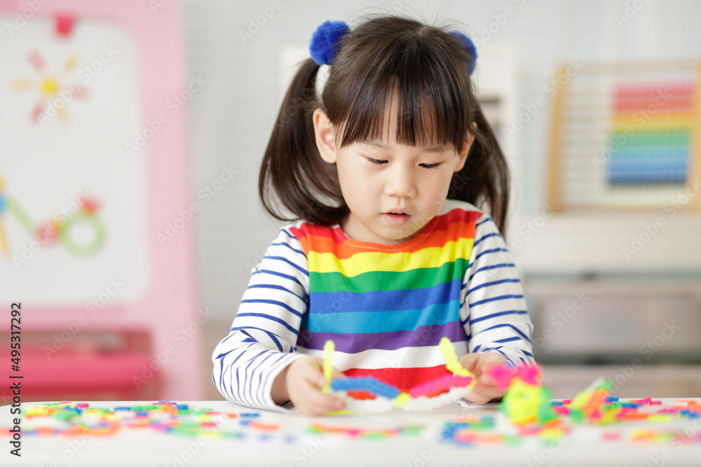 young girl playing creative blocks for homeschooling young girl playing creative blocks for homeschooling