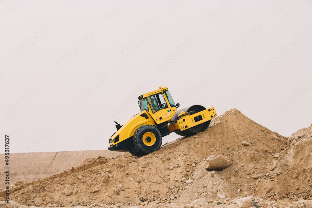 Dozer, excavator, and road rollers working on the mud site Dozer, excavator, and road rollers working on the mud site