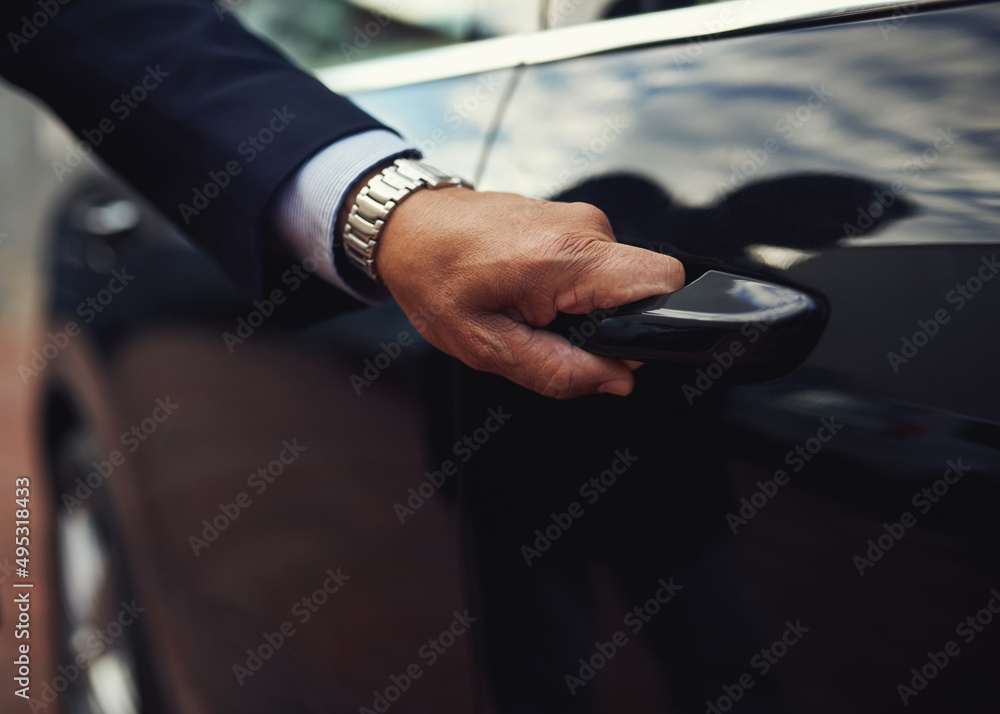Travel in top class style. Cropped shot of a businessman opening a car door. Travel in top class style. Cropped shot of a businessman opening a car door.