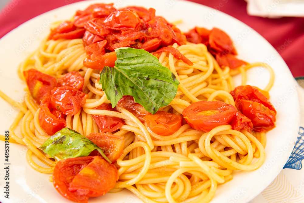 delicious spaghetti with tomato sauce in a white dish delicious spaghetti with tomato sauce in a white dish