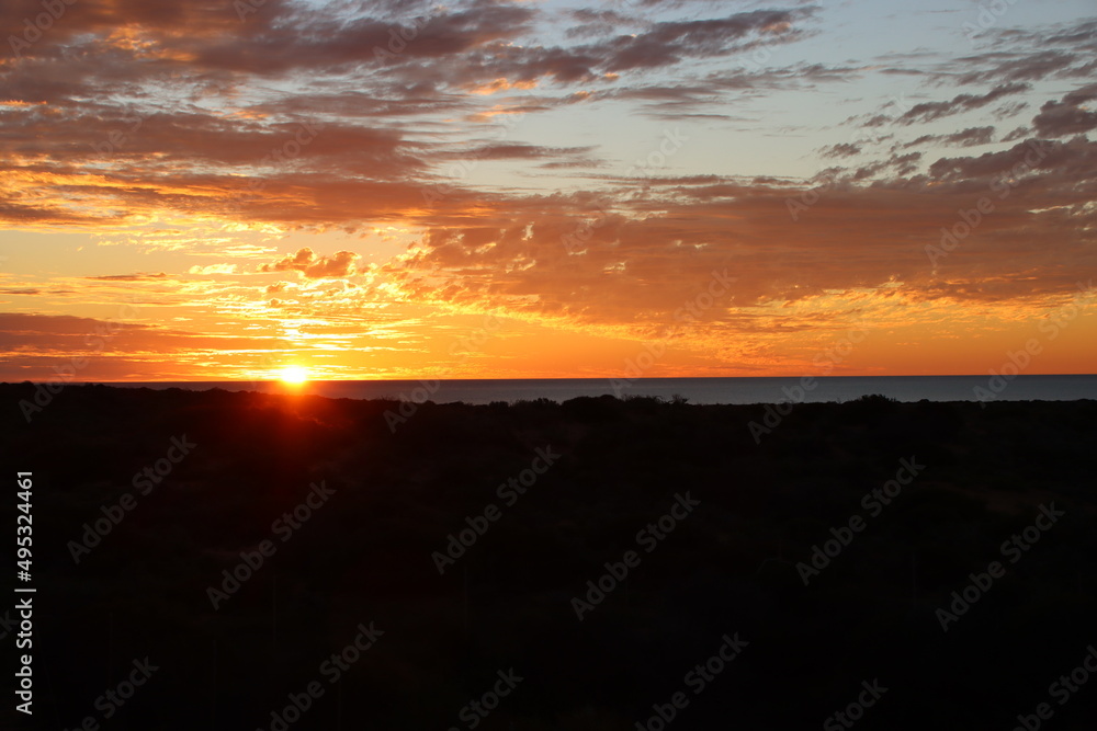 Sun setting over Shark Bay near the town of Denham, Western Australia. Sun setting over Shark Bay near the town of Denham, Western Australia.