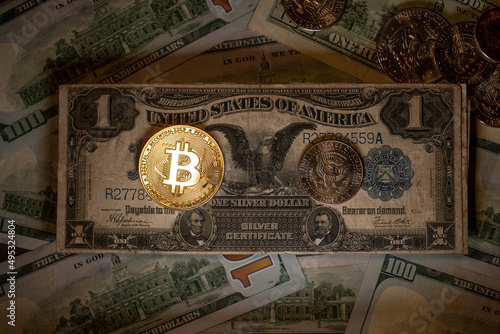 Shining Gold Bitcoin on Black Eagle Dollar banknote. Digital currency BTC