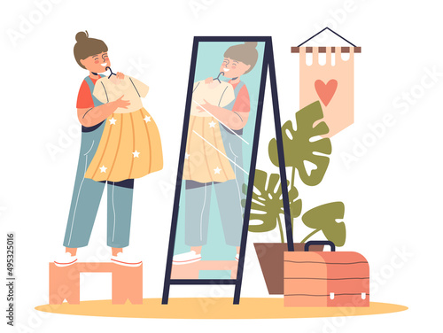 Small girl dressing up change dress clothes in front of mirror. Little kid try new clothing at home