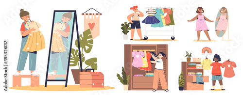 Set of small kids girls dressing up. Little children choosing, trying and buying new clothes dresses