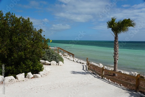 The view of the walking path overlooking the crystal clear blue water by the beach at Bahia Honda State Park  Big Pine Key  Florida  U.S