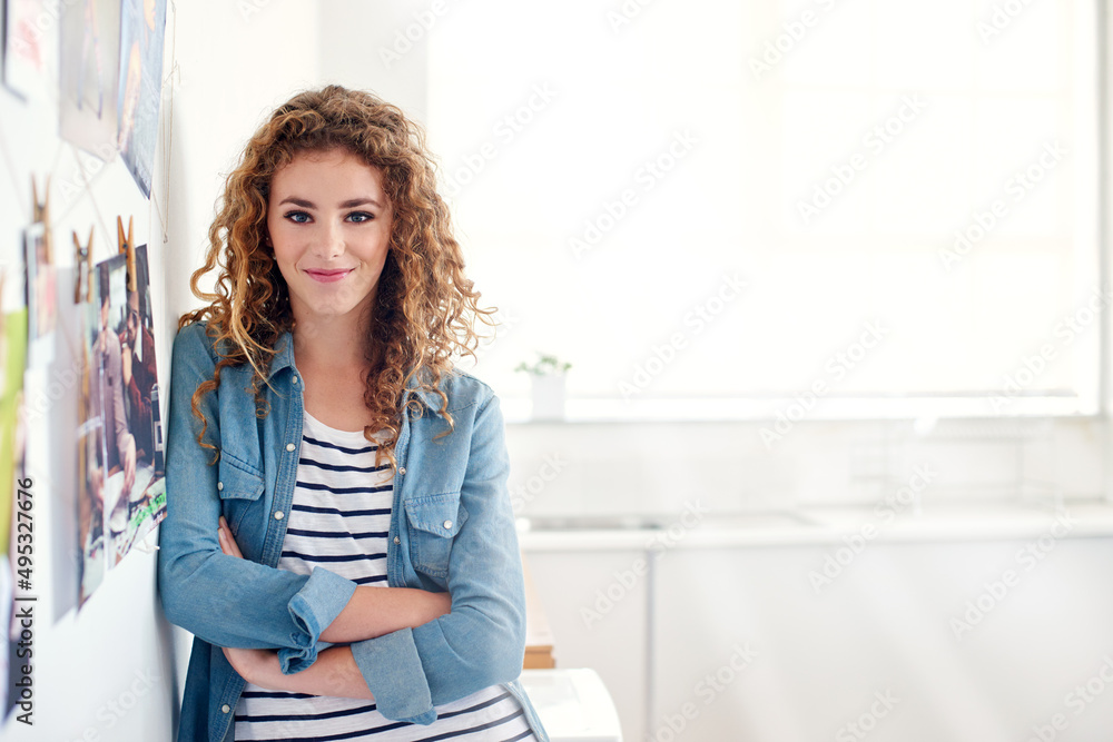 Shes a creative professional. Portrait of a young graphic designer standing in her office. Shes a creative professional. Portrait of a young graphic designer standing in her office.
