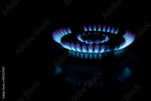 Blue gas flame. Gas crisis in Europe. Rising gas prices. Fuel energy. Russian gas. Blurred background for banner and media