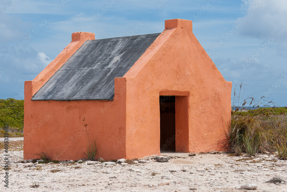 Single historic red slave hut in Bonaire, Caribbean Single historic red slave hut in Bonaire, Caribbean