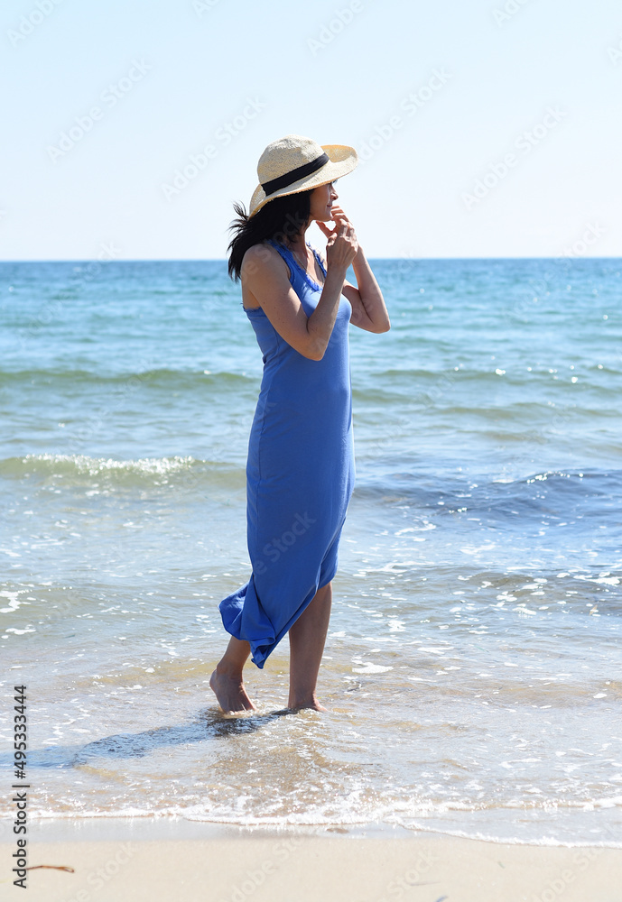 45 years old Russian woman standing in Japanese sea and looking away 45 years old Russian woman standing in Japanese sea and looking away