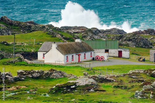 Atlantic storm waves beat the coast near Malin Head on the Inishowen Peninsula, County Donegal. Northernmost tip of Ireland. photo