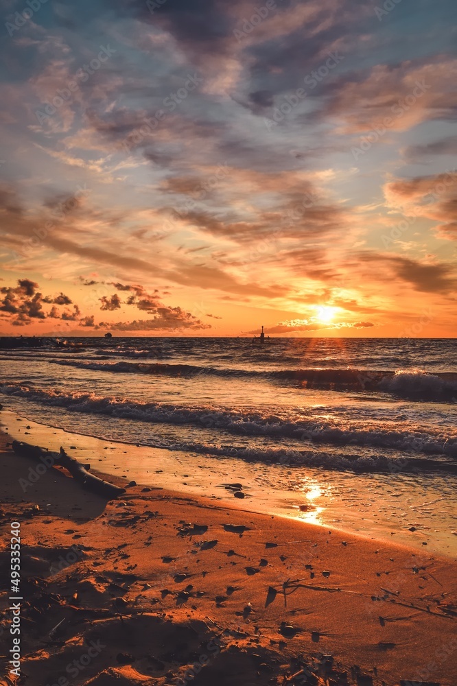 Beautiful summer holiday landscape. Sunset on a sandy beach by the Polish sea.